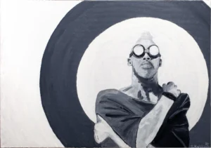 mann-mit-schweisserbrille-vor-schwarzem-kreis