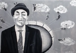 mann-mit-hut-und-kettenkarussel-im-hintergrund