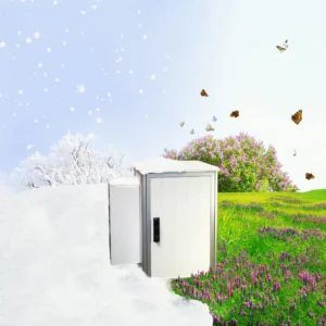 schaltschrank-auf-einer-wiese-mit-schnee-auf-der-einen-ind-gras-auf der-anderen-seite