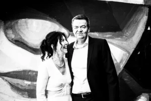 medium-shot-black-white-couple-infront-graffiti