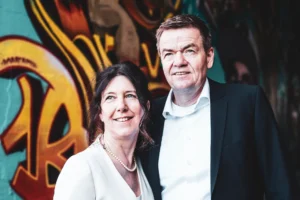 medium-close-shot-couple-infront-graffiti